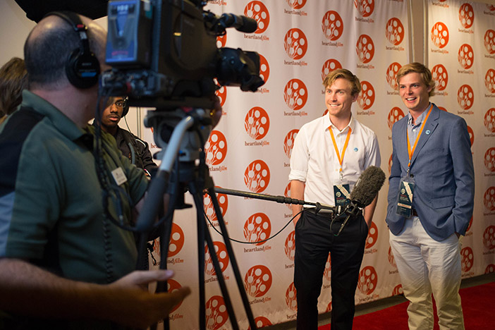 Actor Thatcher Robinson and Director Edd Benda get interviewed on the red carpet at Opening Night of the 2015 Heartland Film Festival